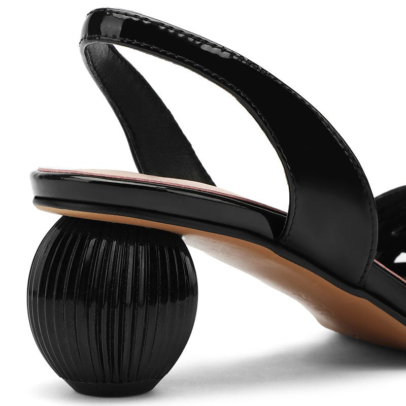 Pointed hollow cowhide sandals for women with a ball shaped heel and a button up sandal
